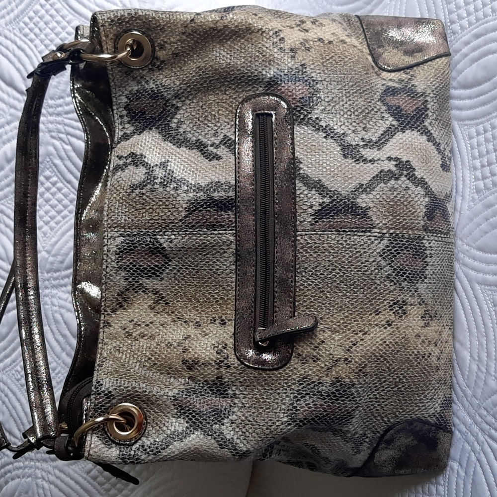 Crystale faux croc print purse  with straps.  Zippered pockets